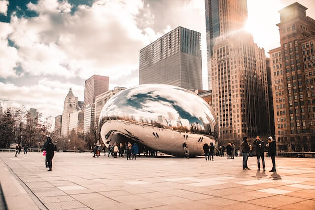 The Bean in Millennium Park, Chicago, with skyscrapers standing tall behind it