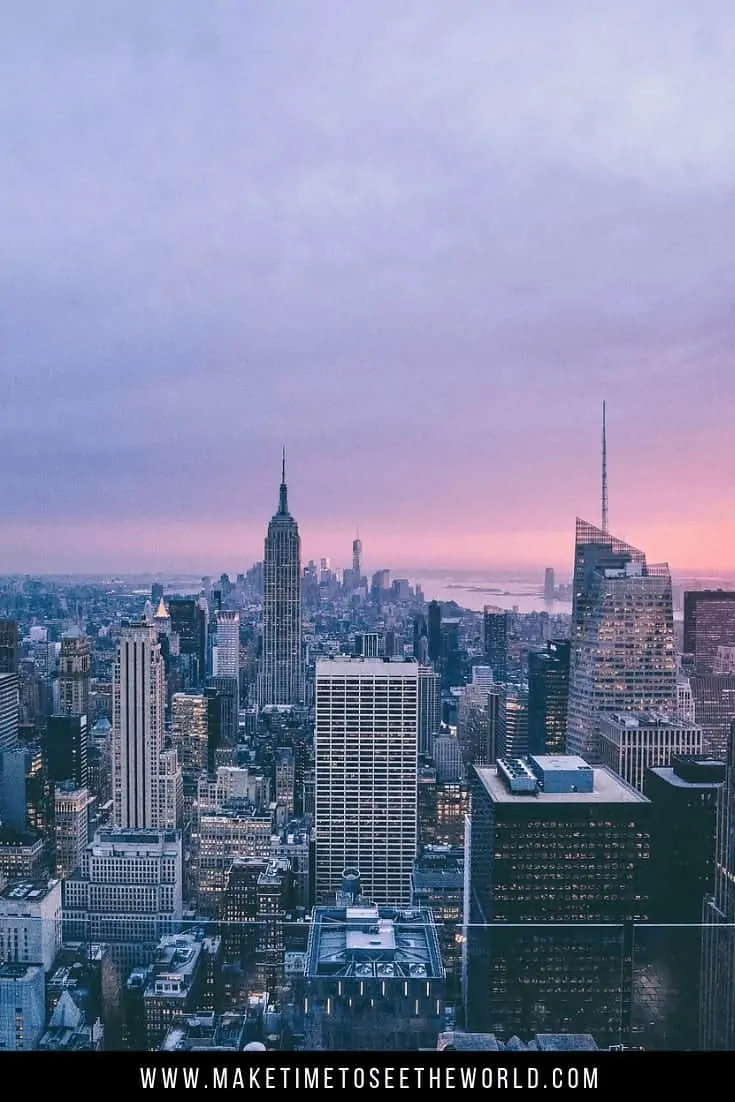 Things To Do in NYC pin image - aerial shot of the New York skyline at dusk