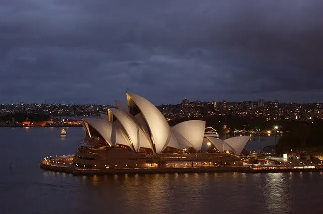 Sydney Opera House at dusk under a deep purple sky