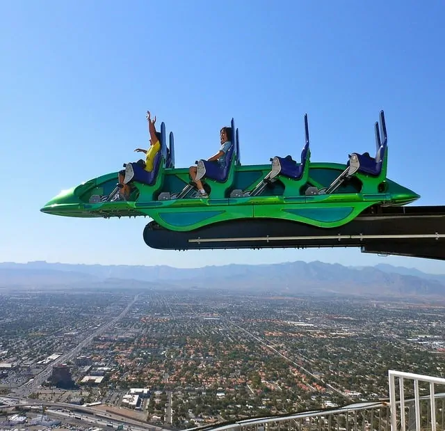 View at the top of the Stratosphere Hotel in Las Vegas, Nevada. The very  top of the tower, the 'Big Shot' ride, is pictured against a blue cloudy  sky. Copy space on