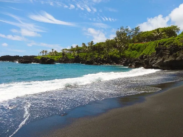 Things to do in Hawaii - visit the Black Sand Beaches along the coast of Hawaii