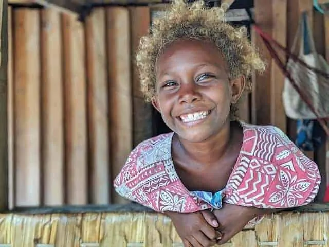 Young Solomon Islander smiling with amazing blond Afro