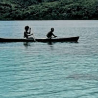 Solomon Islands People - Two People of Solomon Islands in a Canoe