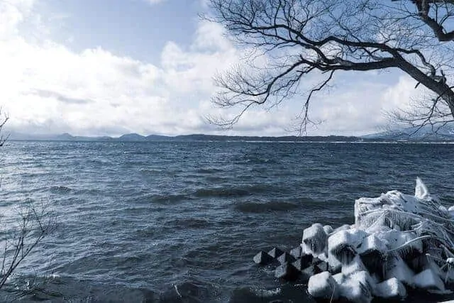 Lake Inawashiro with ice crust across the breakers