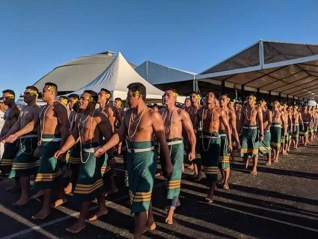 Samoan shirtless men walking in a parade to celebrate Samoan Independence