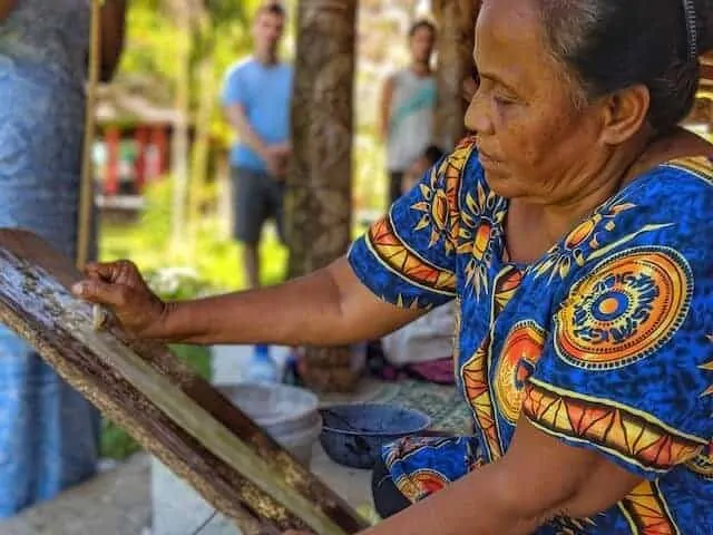 Lady making paper in a traditional way in Samoa