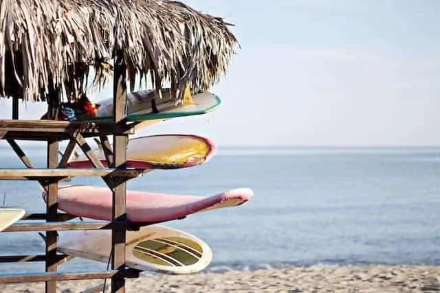 Surfboards in a rack on the beach