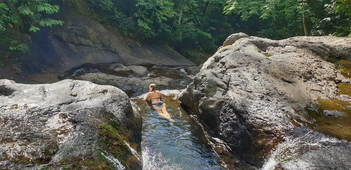 Vicki lying in the water at the edge of a rockpool