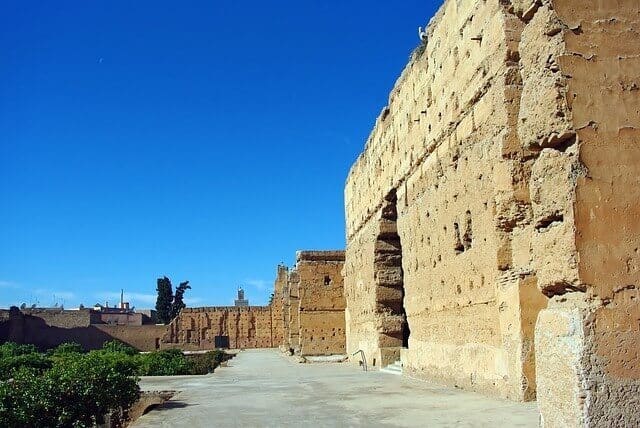 Side view of the stone walls that surround El Badi Palace in Marrakech