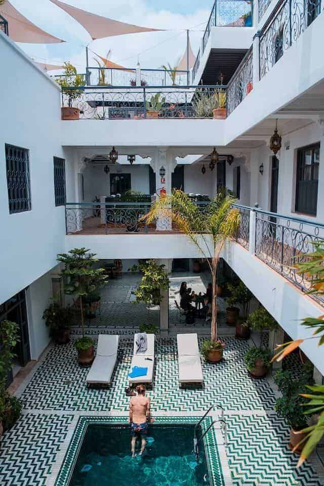 Rodamon Riad Marrakech taken from the upstairs balcony looking down on the swimming pool and sun loungers below