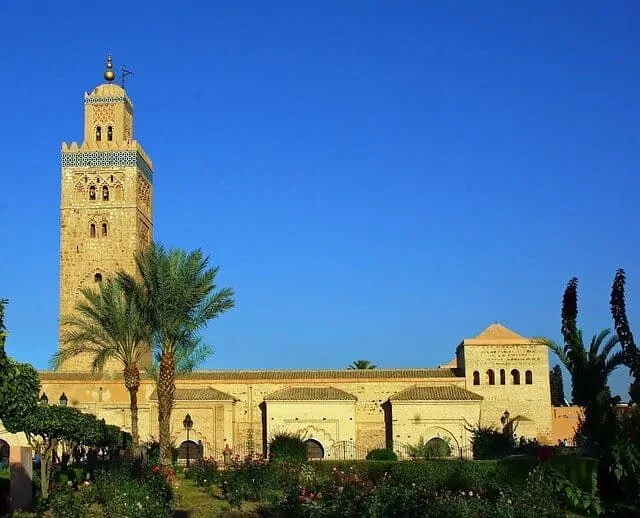 side view of the koutoubia mosque marrakech with a blue sky backdrop