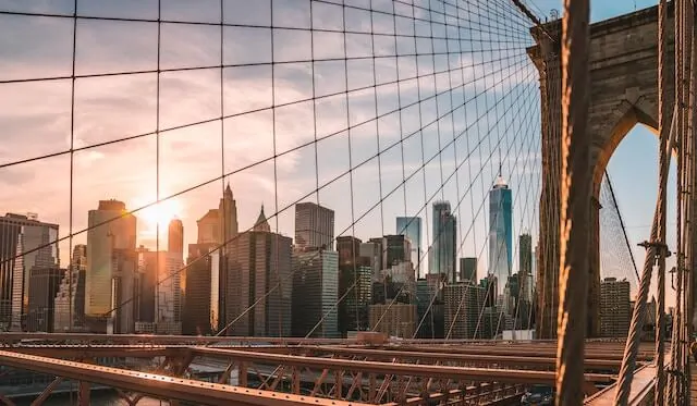 Sunrise through the wires of the Brooklyn Bridge New York