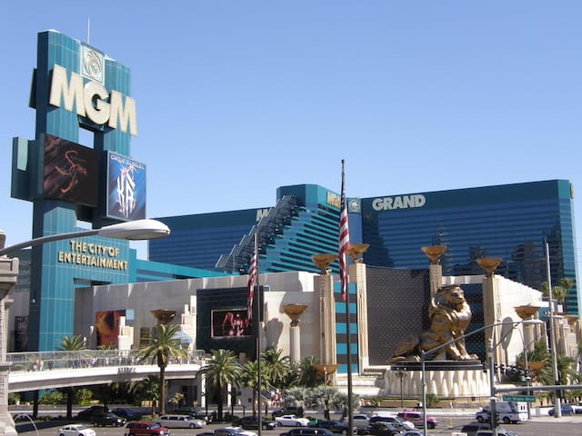 Large Emerald Green Building of the MGM Grand Las Vegas guarded by a giant Gold Lion