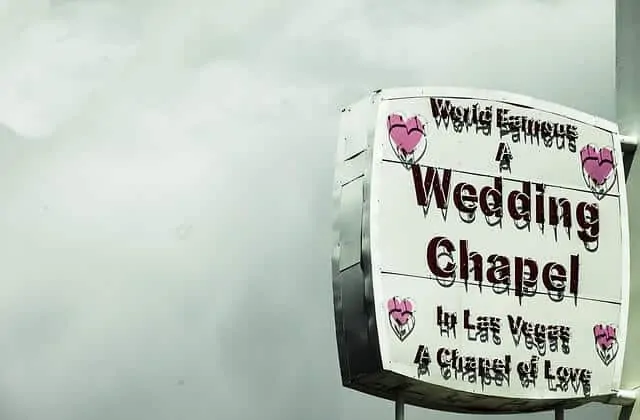Little White Wedding Chapel neon sign in day time