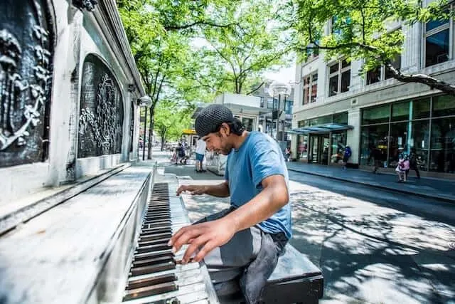 16th Street Mall Denver with man playing one of the street pianos