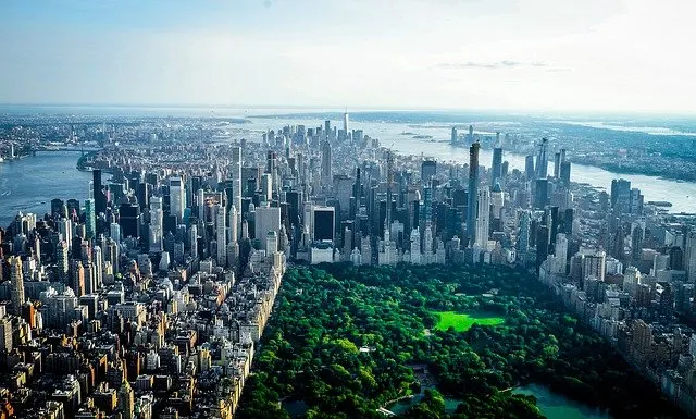 Manhattan from above with Central Park fringed by skyscraper buildings