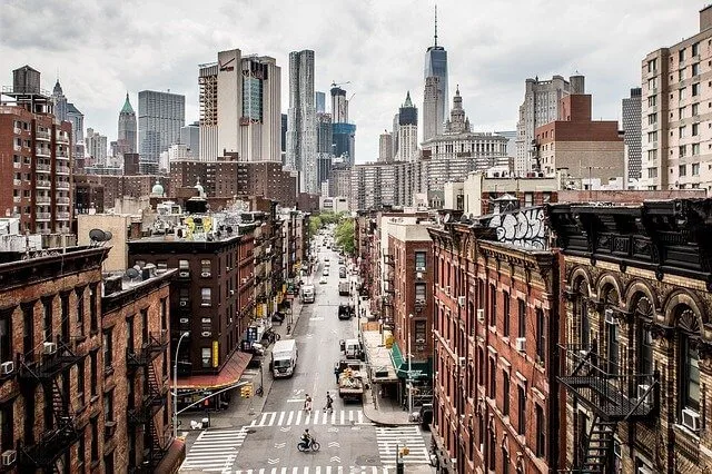 Aerial view looking down a street in New York City with skyscrapers in the background