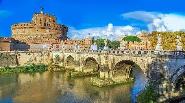 A Bridge adorned with regigious statues leading to Castel SantAngelo in Rome Italy