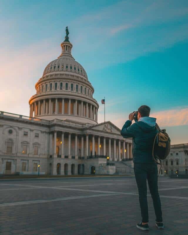 Man photographing Capitol Hill
