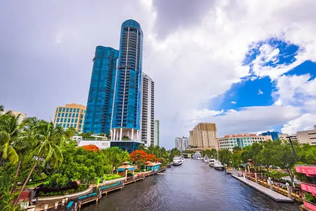 Riverwalk Arts and Entertainment District with sky scraper buildings on one side of the river