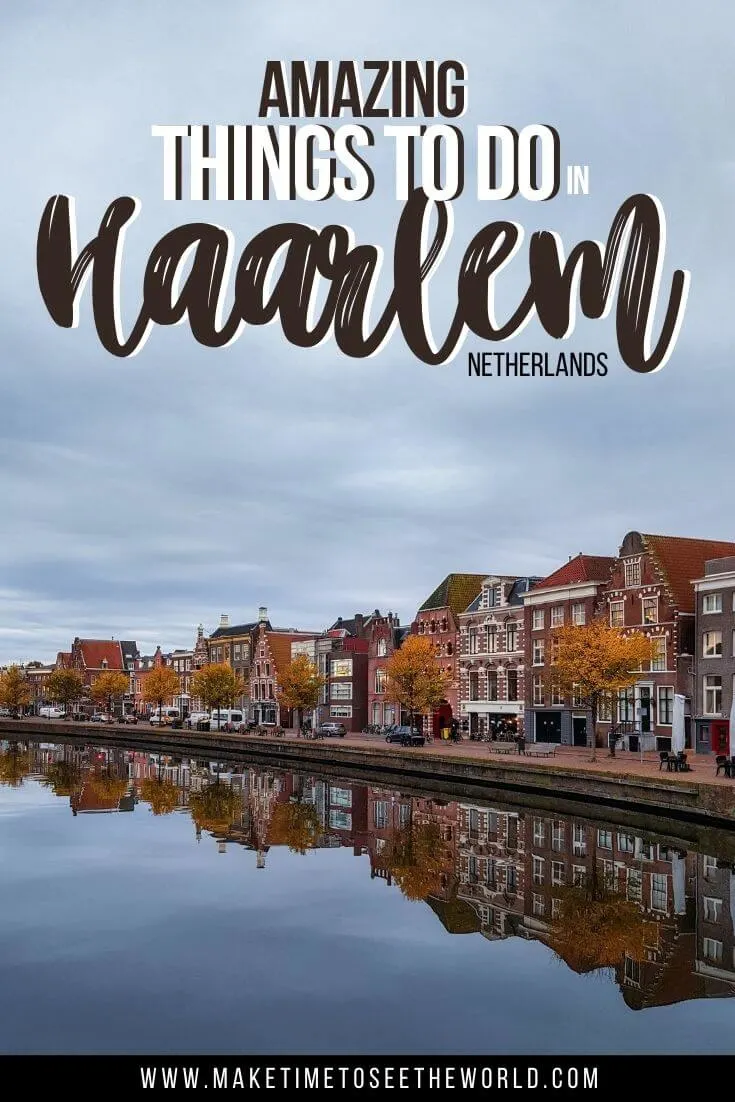 Pin image showing a river with houses along the far bank, reflecting in the river with the text overlay stating 'Amazing Things to do in Haarlem Netherlands'