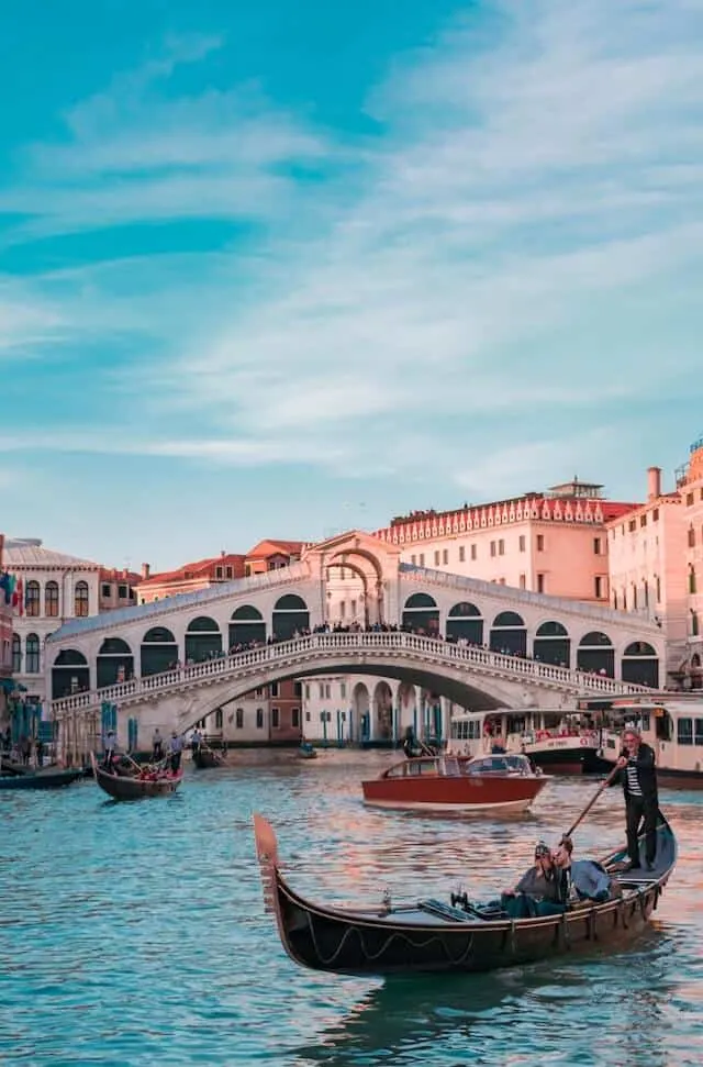 Gondola on the grand canal in Venice with the Rialto Bridge in the Background