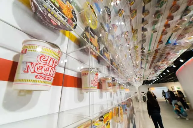 Different types of Cup Noodles on the wall at the Cup Noodle Museum