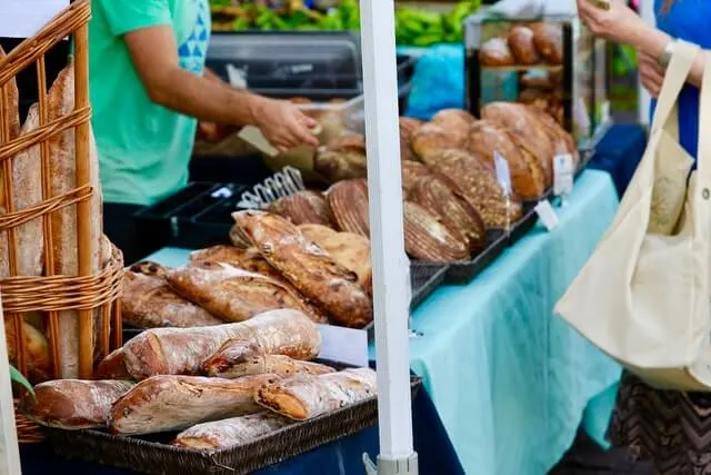 Fulton Street Farmers Market stall of freshly baked loaves of bread