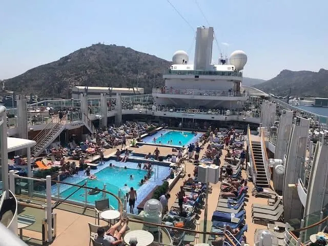 Pool deck with lots of people on a cruise ship