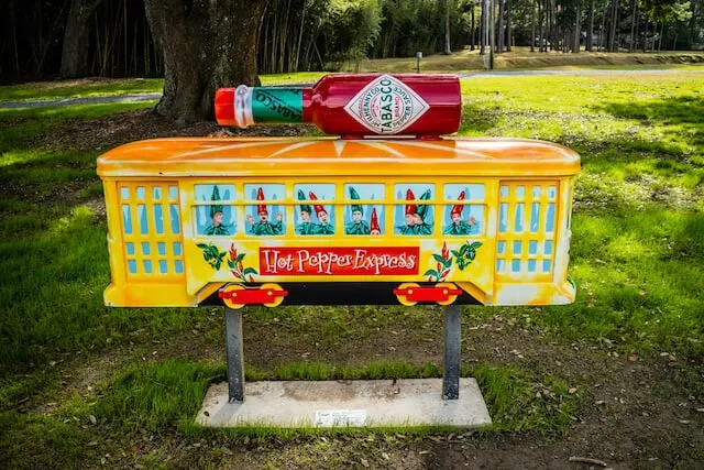 Tobasco Museum sign with tobasco sauce bottle lay down on top