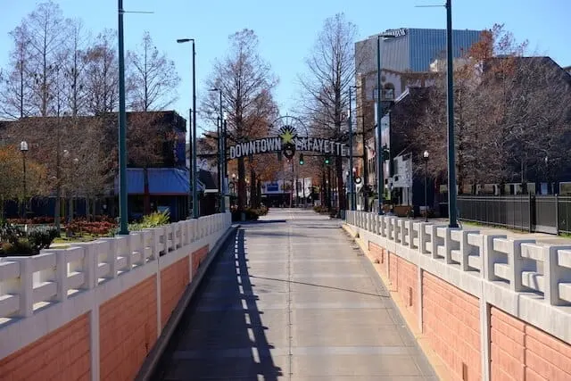 Walkway ramp rising up to the arched Downtown Lafayette sign