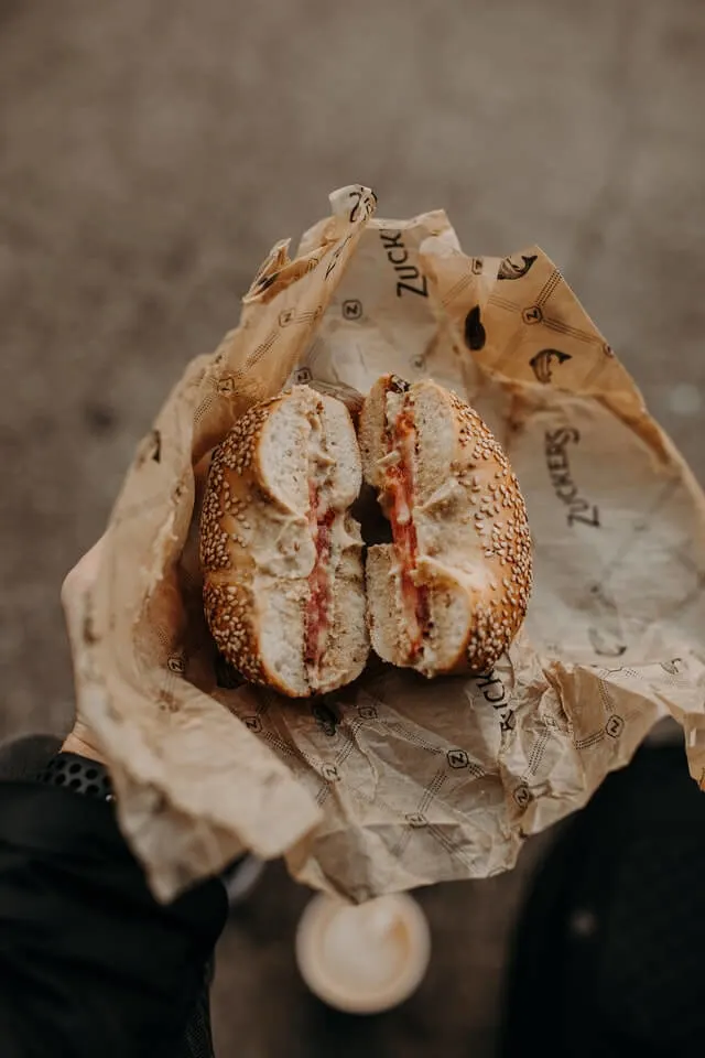 Bagel in a paper wrap to eat on the go
