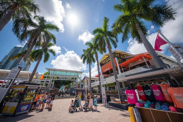 Bayside marketplace with bright coloured souviners displayed outside storefronts