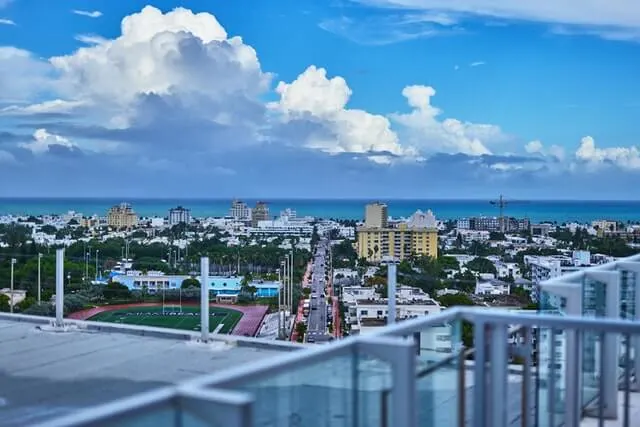 View from a hotel balcony set back from the main beach in Miami with the ocean in the background