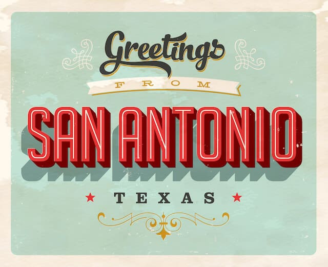 Greetings from San Antonio Texas Green Postcard with black red and white lettering