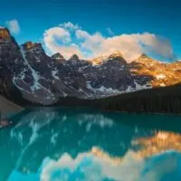 Things to do in Banff in Summer cover image of an Emerald Lake with a rocky mountain backdrop under a blue sky