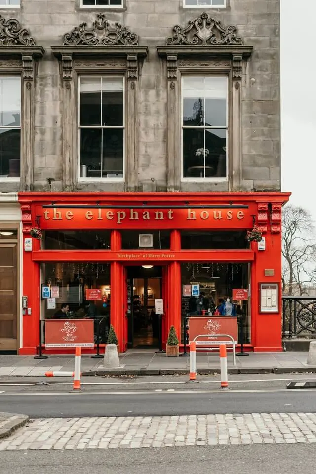 Red frame facade on the stone building which maks the Elephant House cafe 