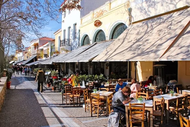 Street lined with cafes and shops in Thisseio Athens