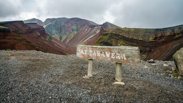Wooden sign in front of Mount Tarawera Volcanic Crater