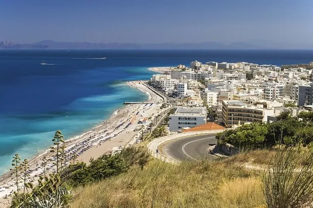 Road winding down to a greek village on the coast