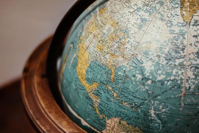 Close up of a globe with wooden casing