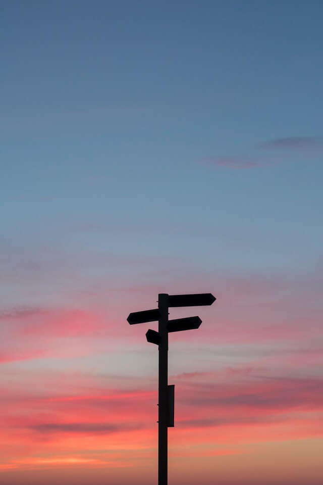 Signpost in silohuette with a candy cotton sky backdrop