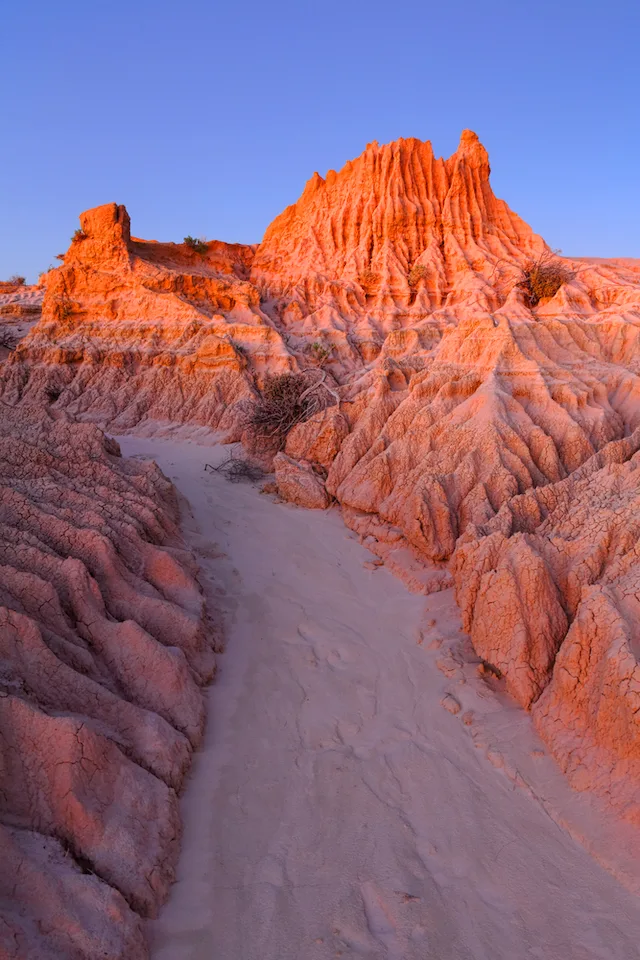 Dusk glow illuminating the amazing eroded land forms in outback desert landscape at Willandra Lakes