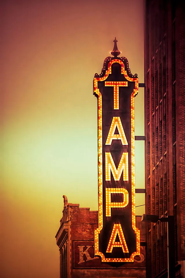 Tampa Theater illuminated sign at sunset