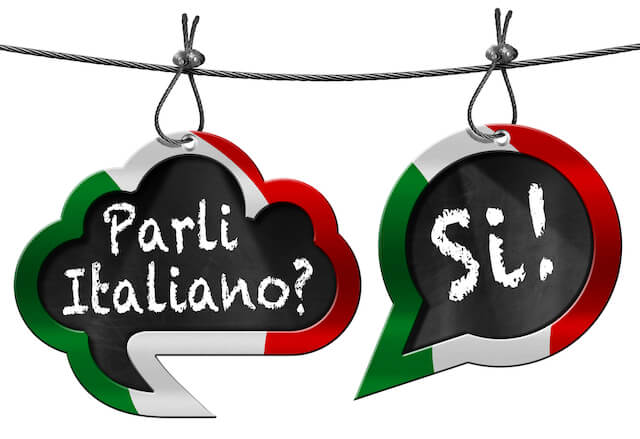 Basic Italian phrases for travel - two speech bubbles bordered by the colours of the Italian flag (green, white and red), one with 'Parli Italiano' the second with 'Si'