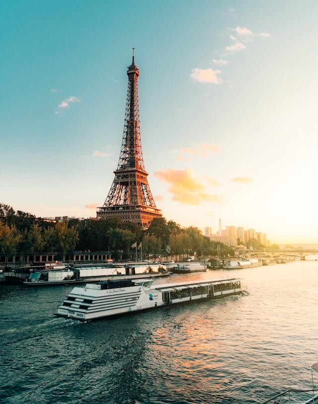 Boat on the River Seine cruising past the Eiffel Tower