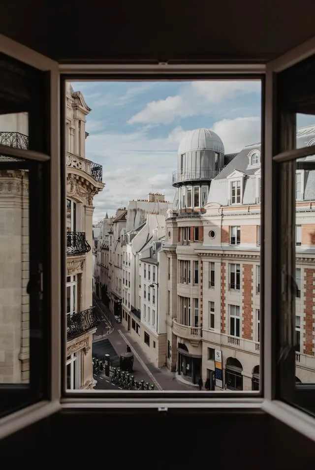 View out of an open window of a hotel in Paris