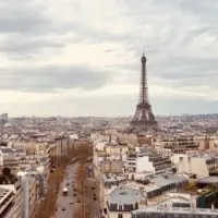 Paris Travel Tips (Perfect for First Time Visitors) cover photo of the view above the city of Paris taken from the Arc de Triomphe