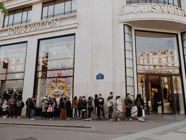 People queuing outside the Louis Vuitton Store