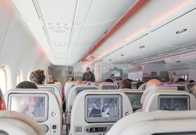 Plane seats with screens in the back of the seat